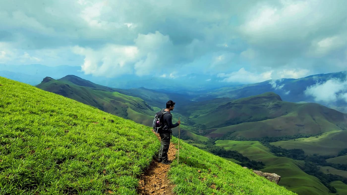 Kudremukha peak rising above rolling Western Ghats ridges